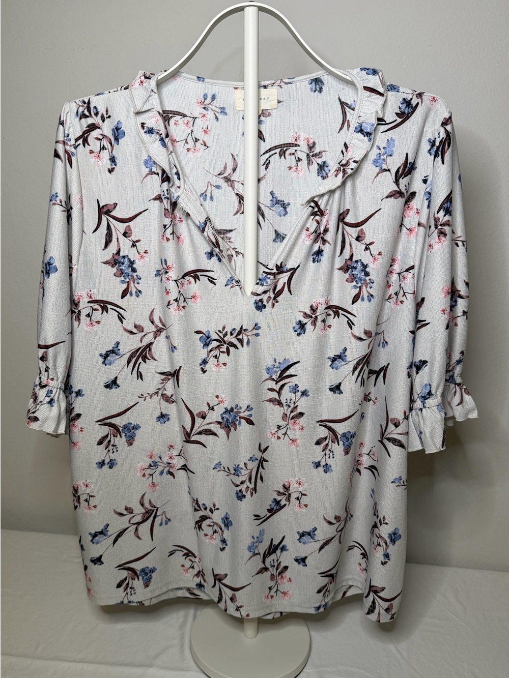 MELLODAY White Floral V-Neck Ruffle Blouse with Blue and Pink Accents